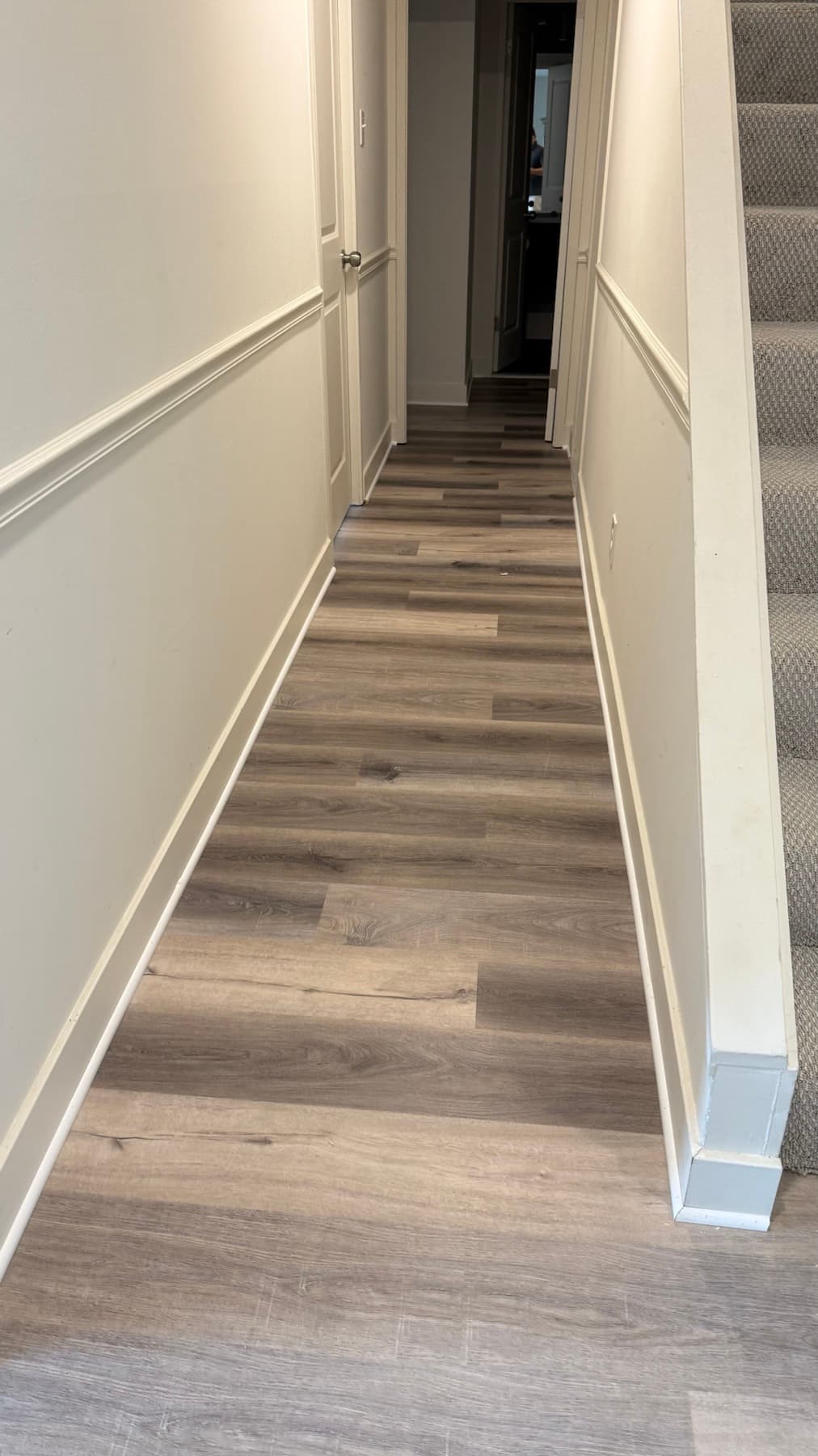 Rhino LVP flooring continuing through a doorway and hallway